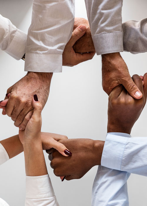 business-hands-joined-together-teamwork business-hands-joined-together-teamwork